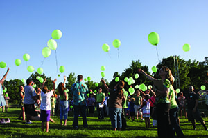 releasing green balloons
