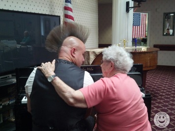 man playing music with dementia patient